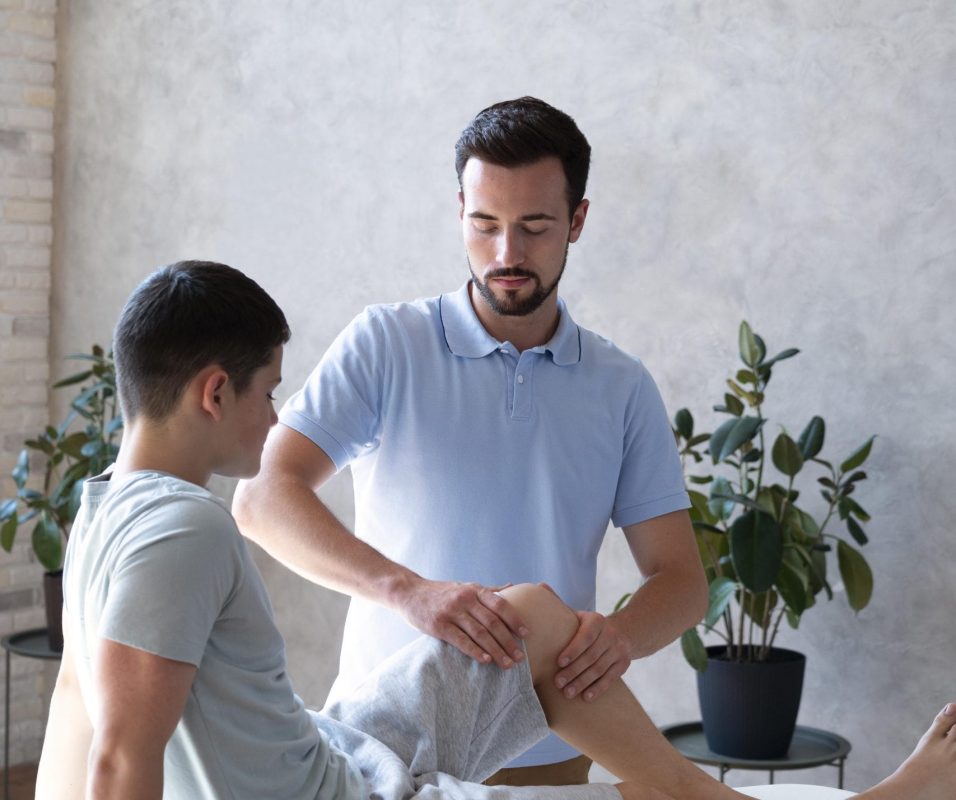 medium-shot-physiotherapist-checking-leg